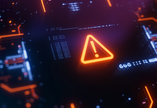 Glowing warning alert symbol on a digital circuit board indicating a cybersecurity threat